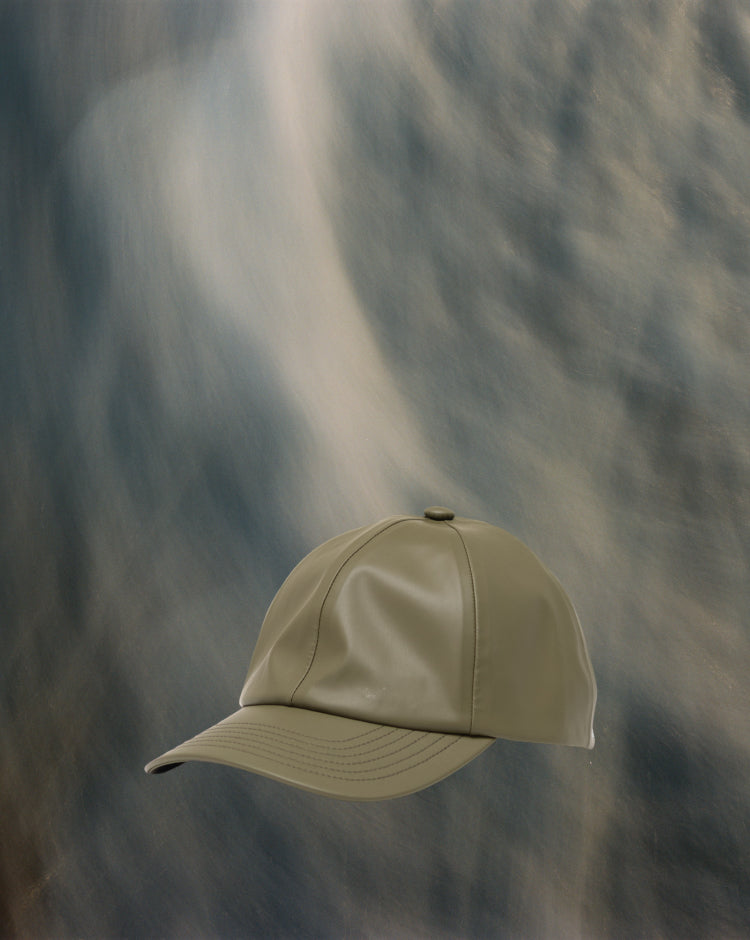 Herschel Supply Co. Sylas Rain Cap in Ivy Green, showcasing a classic six-panel baseball cap design.