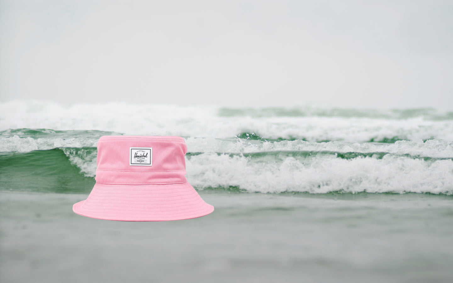 Herschel Supply Co. Toddler Bucket Hat (2-4 Years) in Cashmere Rose, shown from the front on a desktop view.