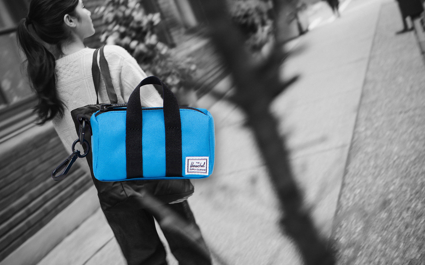 Herschel Novel Duffle Bag Charm in French Blue, shown as a miniature bag accessory against a clean background for an ecommerce product display.