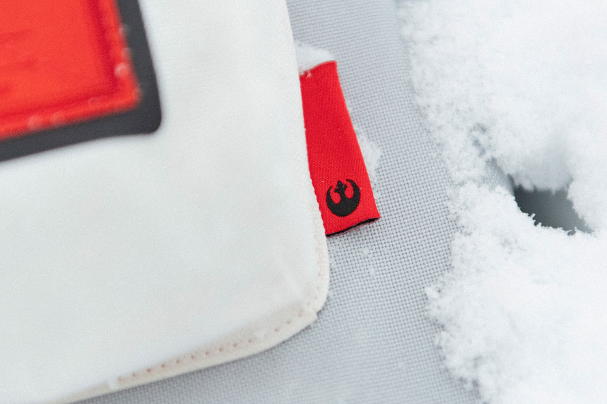 close up shot of the rebel alliance tab on the side of the front pocket of the bag