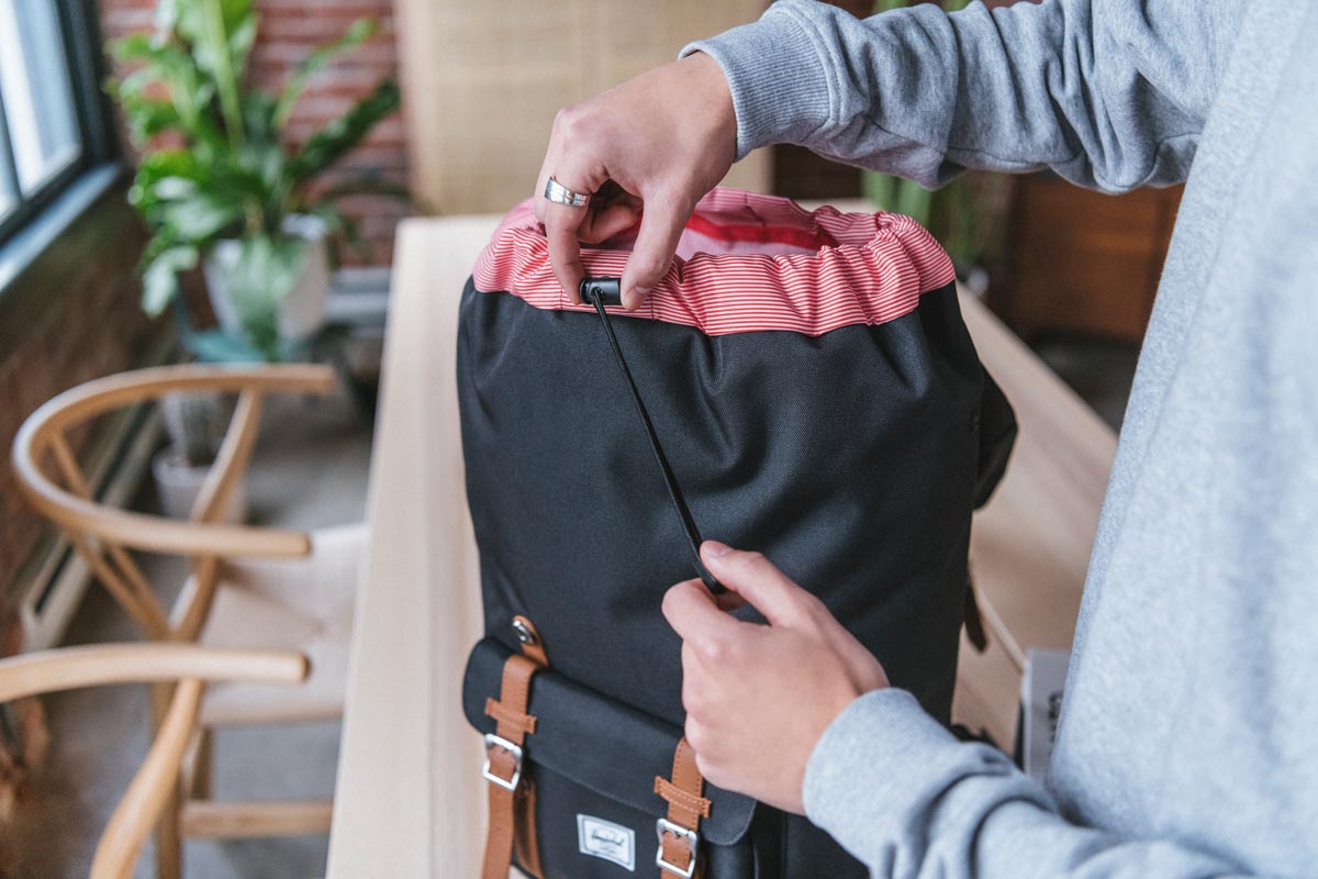 Easy drawcord closure means the Herschel Little America™  can expand to create extra storage space